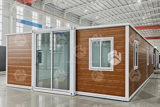 What is a studio side-out container house used for
